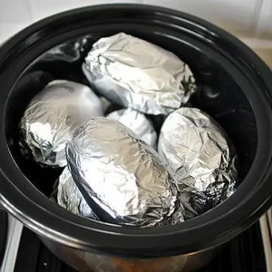 Wrap potatoes in tin foil and put in crock pot. Enjoy this lip-smacking result