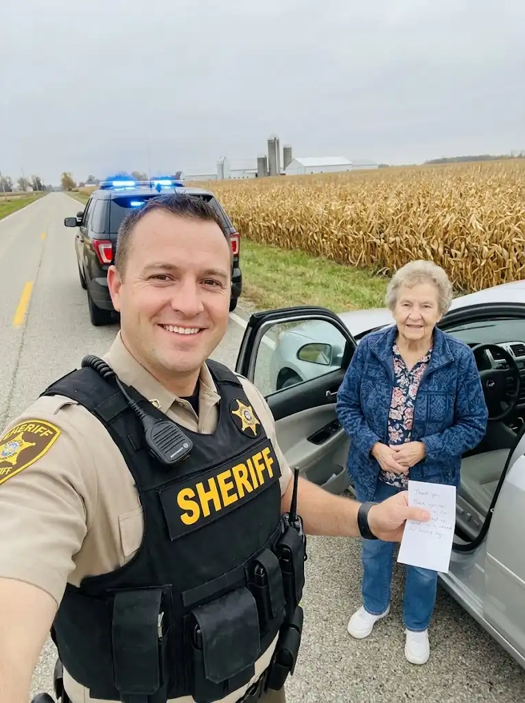 Young Deputy Forces Elderly Woman Into Summer Heat Before Her Name Echoes Across The Radio